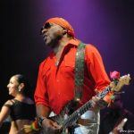 Ernie Isley playing guitar onstage