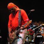 Ernie Isley playing guitar onstage