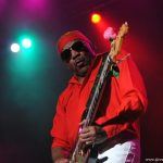 Ernie Isley playing guitar onstage