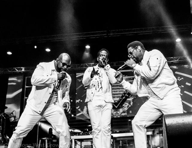 Boyz II Men performing on stage at the State Farm Arena for the 