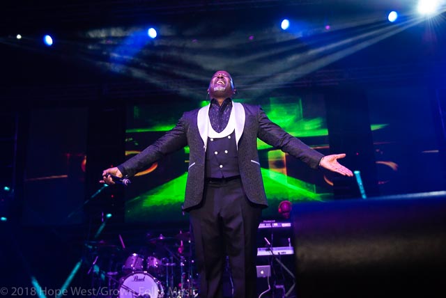 Johnny Gill performing on stage at the State Farm Arena for the 