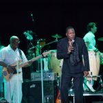 Eric Grant of The O'Jays performing onstage at Chastain Park