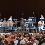 The O'Jays performing onstage at Chastain Park